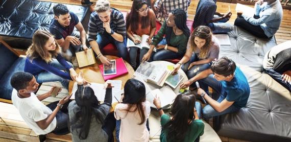 Students in a circle discussing a topic